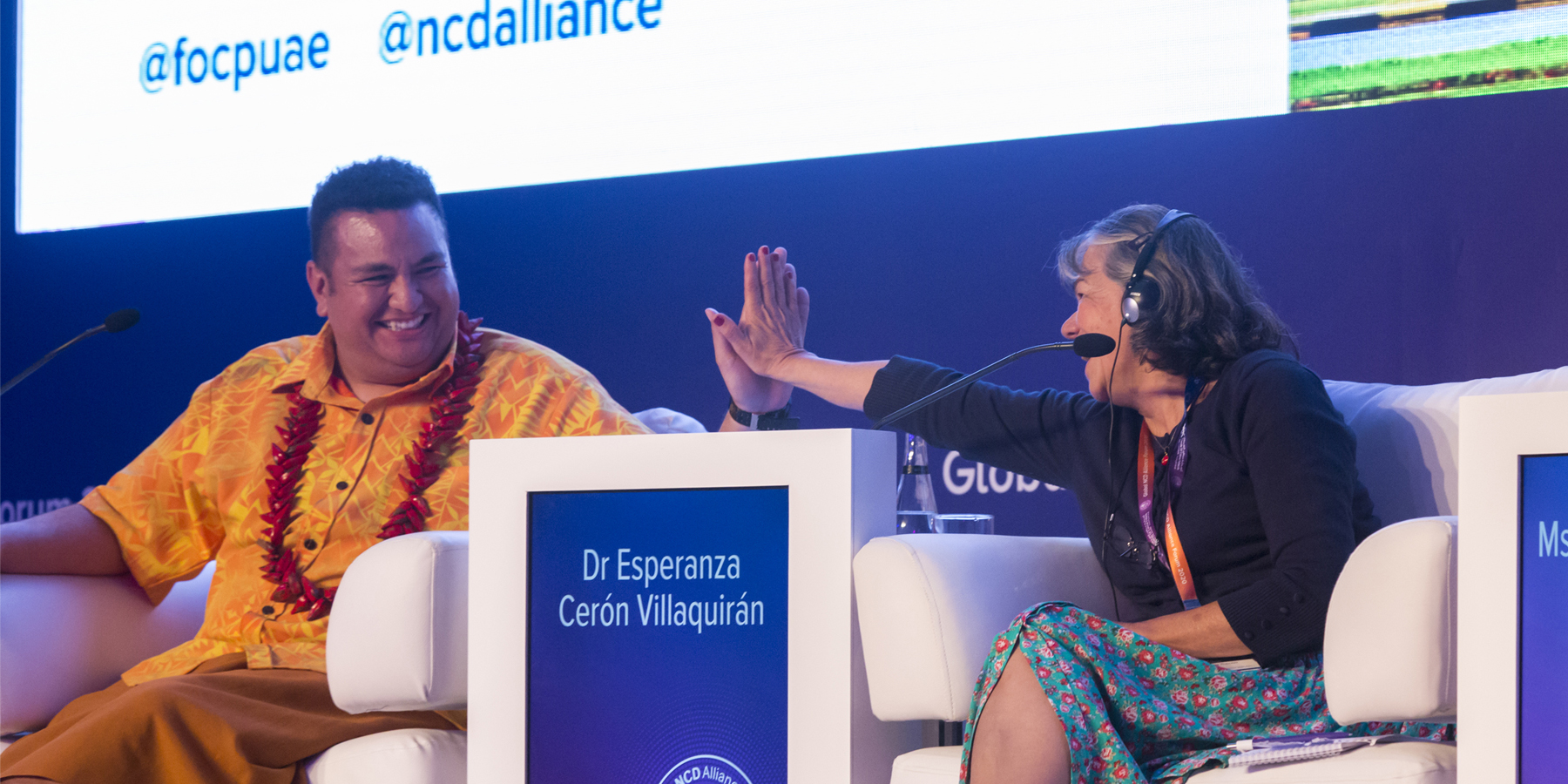 Global forum delegates high-five on panel event